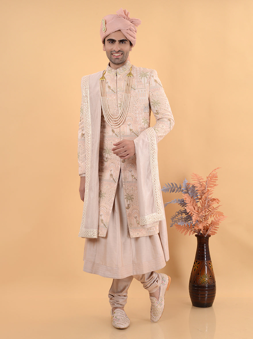 Elevate your wedding attire with this Champagne Peach Sherwani, designed for grooms in the USA, combining a luxurious silk blend with exquisite embroidery for a standout look at any formal event.