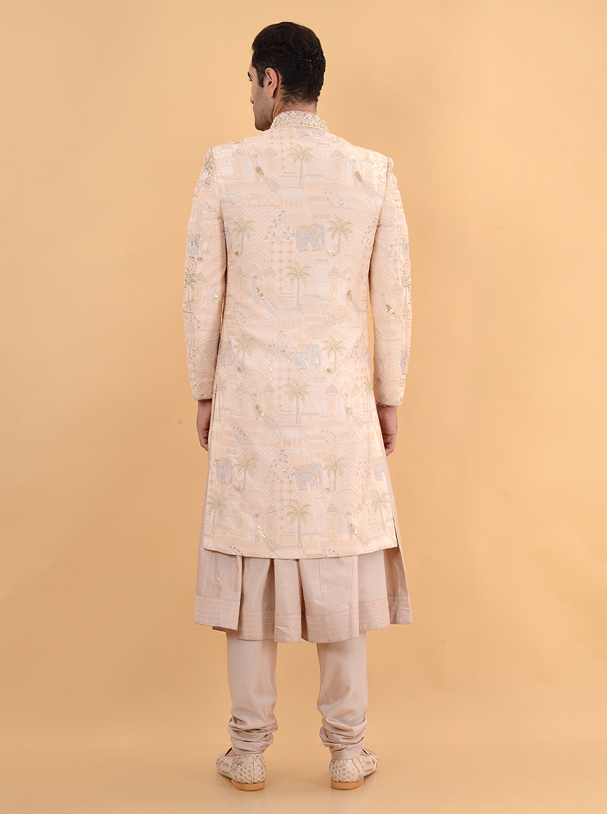 This modern Champagne Peach Sherwani offers a luxurious silk blend and intricate embroidery, making it an exceptional choice for grooms in the USA celebrating weddings and formal occasions.