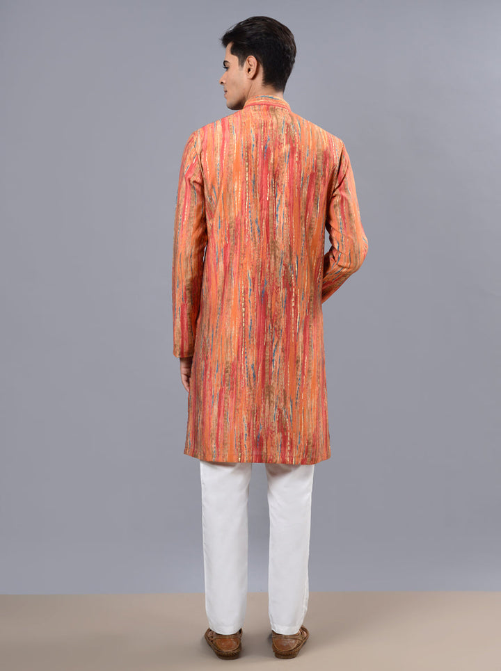 Celebrate in style with our orange kurta pajama, designed for elegance during pooja events.