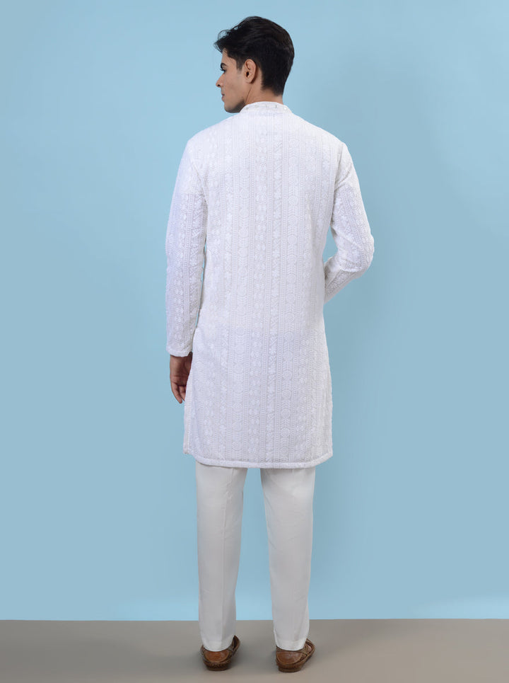 White silk kurta pajama for men, ideal for adding a touch of sophistication to festive occasions.