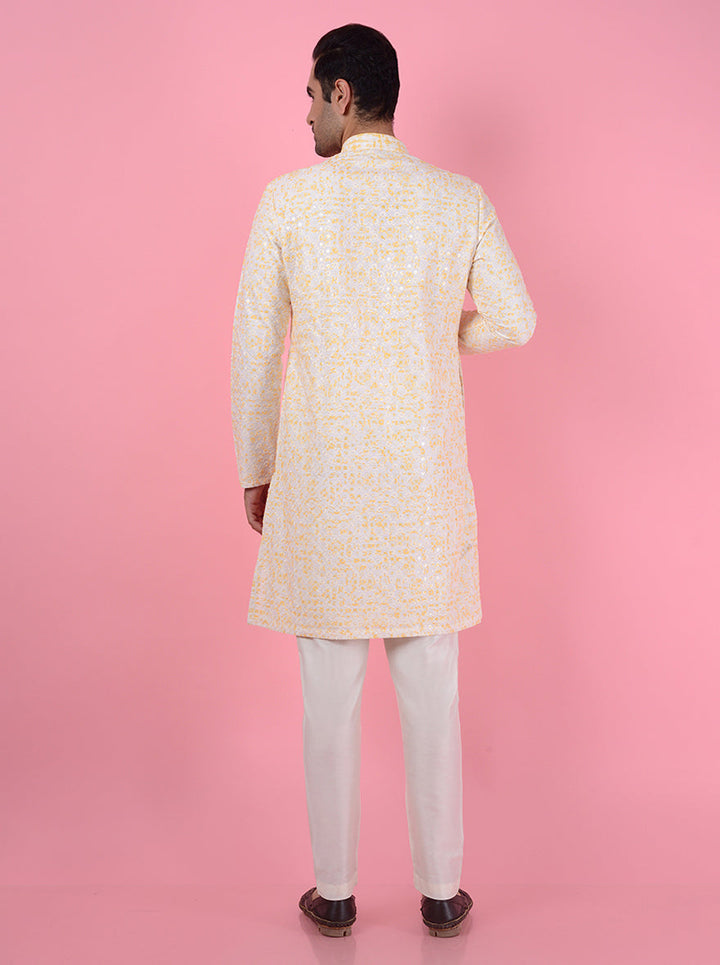 Stylish cream and yellow kurta pajama, crafted from silk, ideal for cultural celebrations in the USA.