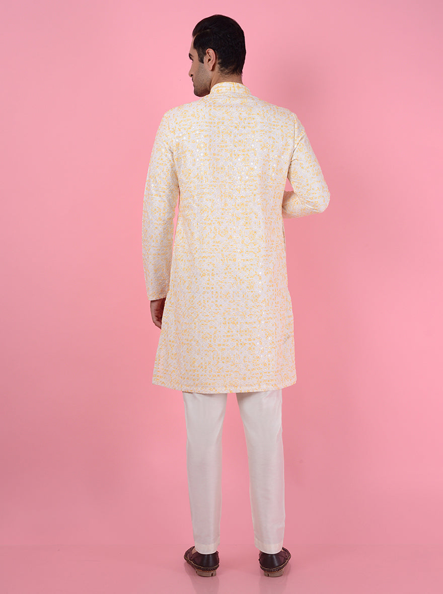 Premium embroidered cream silk blend kurta pajama for men, offering a sophisticated look.