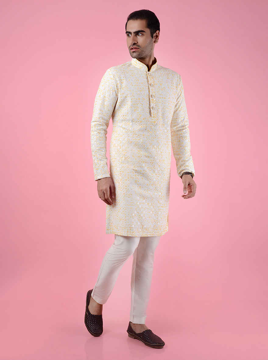 Elegant cream and yellow kurta set, featuring intricate embroidery, perfect for adding charm to special occasions in the USA.