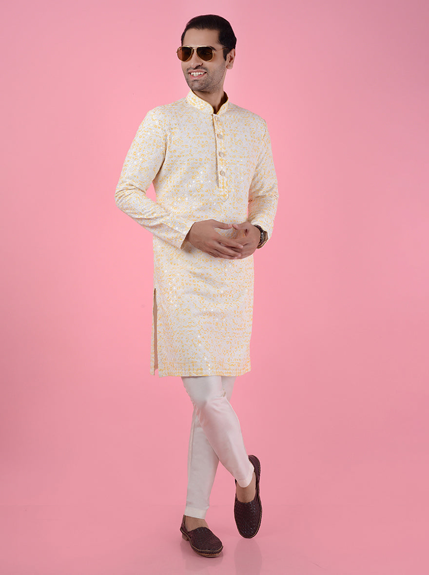 Men’s embroidered cream silk kurta pajama set, perfect for formal events and traditional wear.