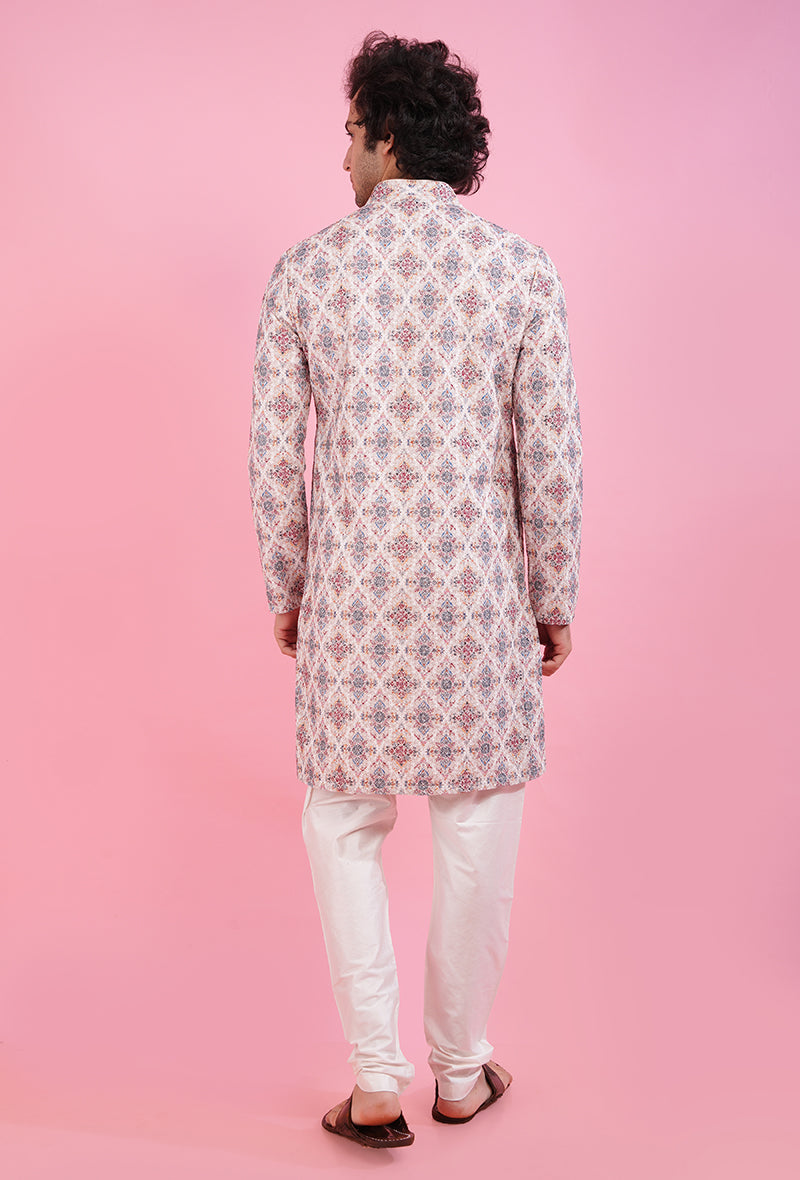 Men’s cream kurta pajama set with fine embroidery, perfect for pooja and weddings.