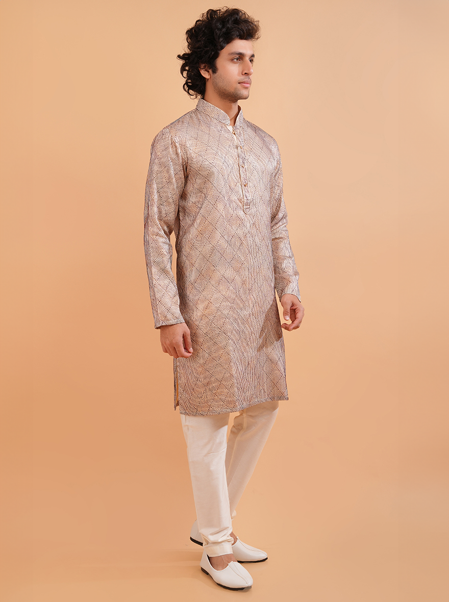 Festive cream kurta pajama set for men with intricate embroidery, perfect for special occasions.