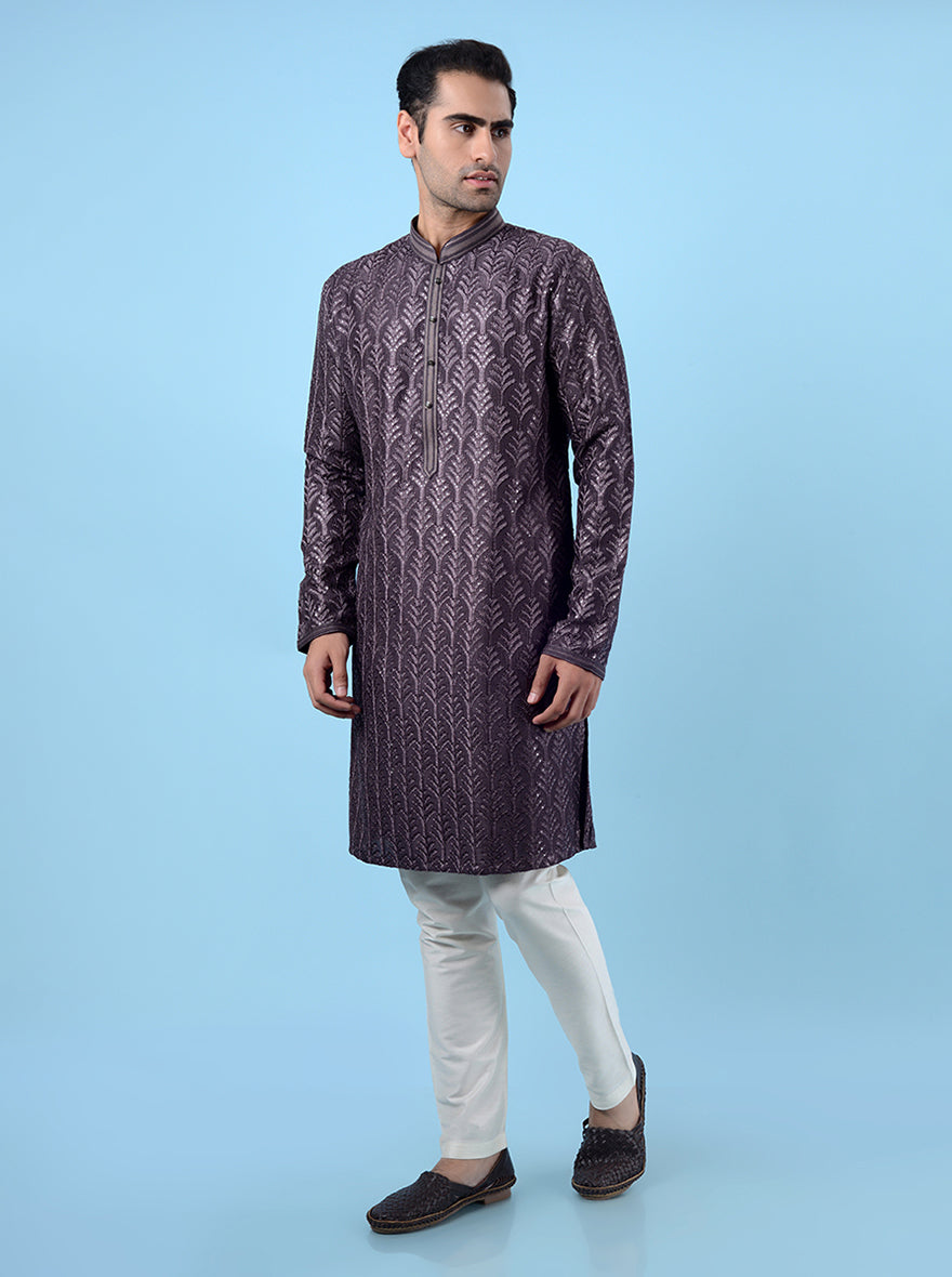 Elegant purple kurta pajama for men, crafted with fine embroidery for festive occasions.