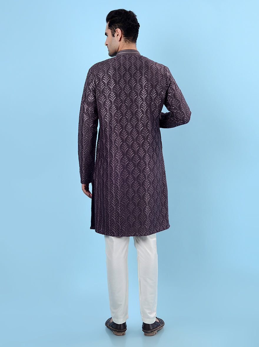 Elegant purple kurta pajama featuring sophisticated embroidery.