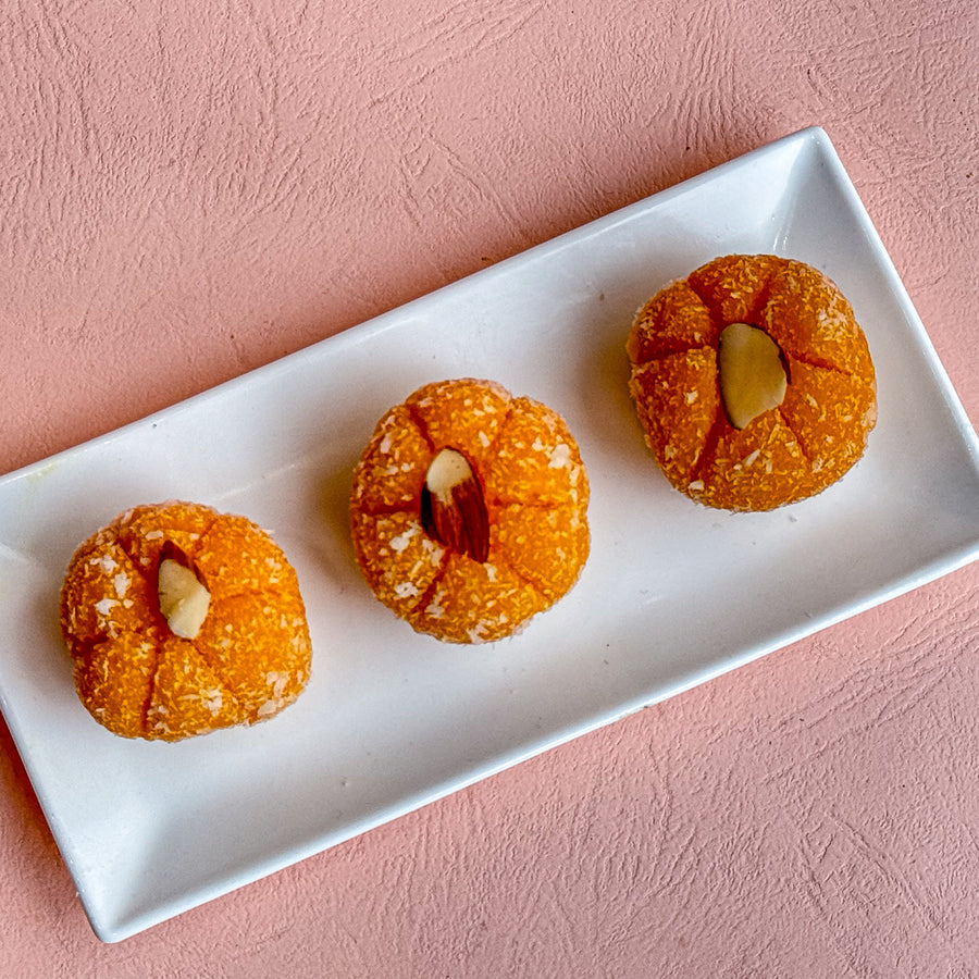 Orange Coconut Penda combines zesty orange and creamy coconut, creating a refreshing, tropical twist on traditional Indian sweets.