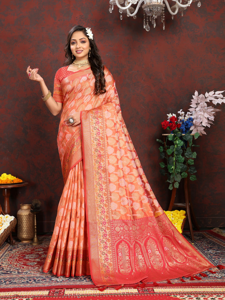 Orange Organza silk saree featuring luxurious Meenakari patterns, ideal for weddings and festivals.