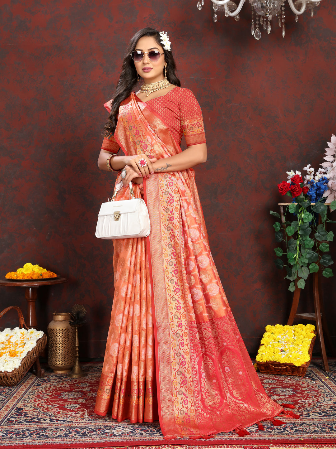 Designer orange Meenakari Organza silk saree with exquisite details, perfect for cultural gatherings.