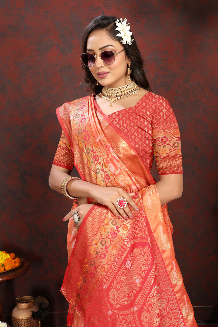 Classic orange Organza silk saree with rich Meenakari artistry, ideal for traditional occasions.