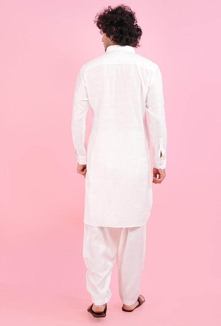 Elevate your ethnic wardrobe with this white Pathani kurta, designed with exquisite resham and mirror work, ideal for weddings and festive gatherings.