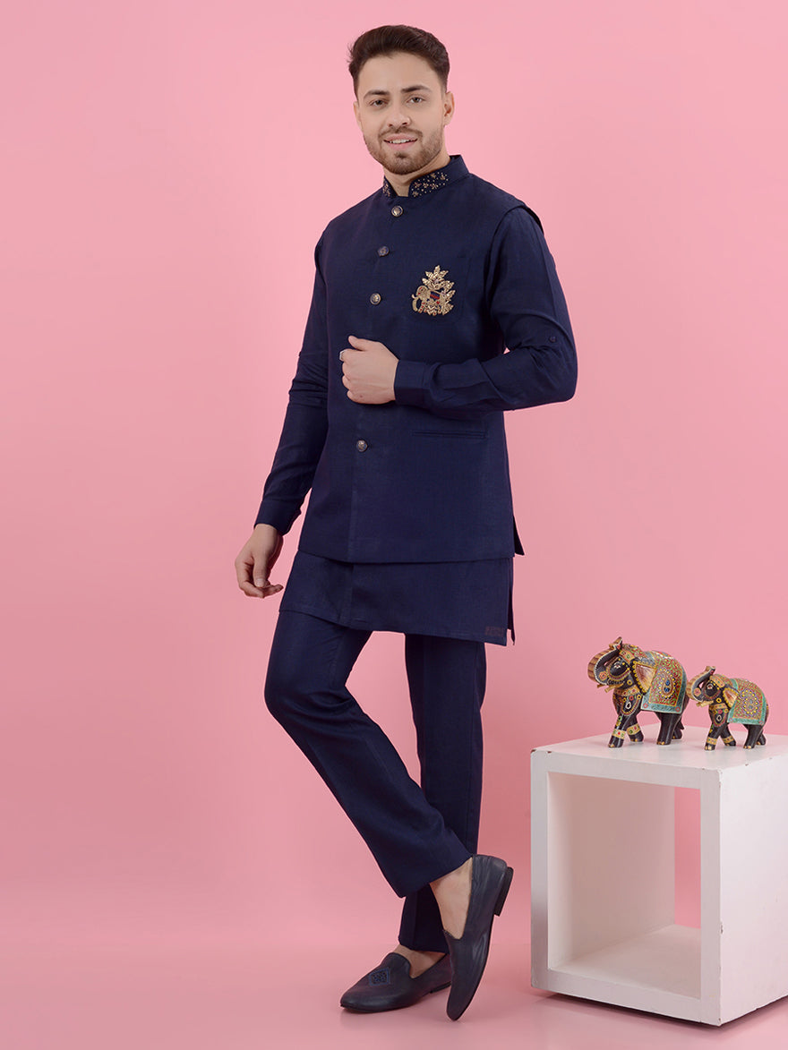 This designer Navy Blue Kurta Pajama showcases intricate embroidery and elegance for modern men at festive events.