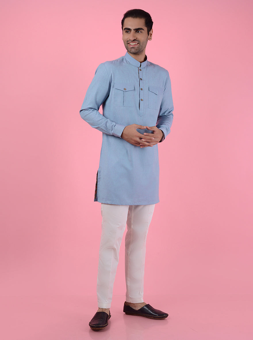 Traditional sky blue kurta pajama set for men, made from silk blend fabric with fine embroidery.