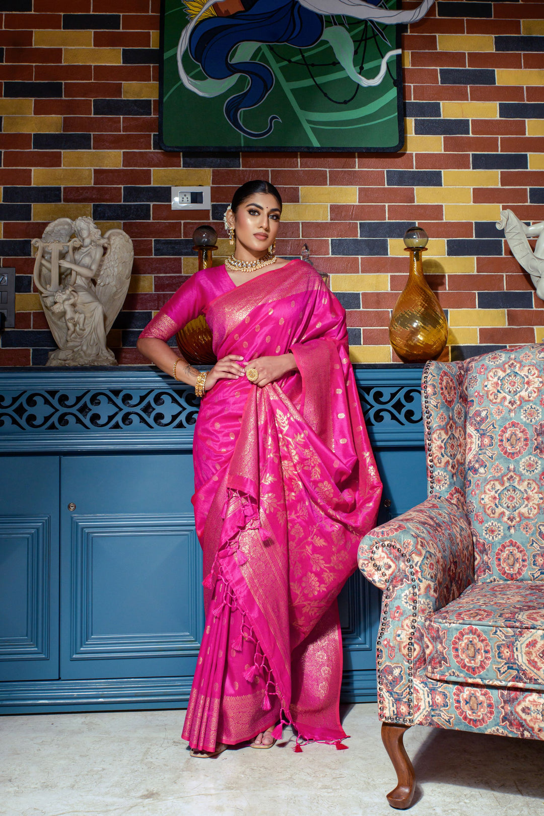 Enhance your festive wardrobe with this Bright pink Designer saree, showcasing intricate zari work and a running blouse piece.