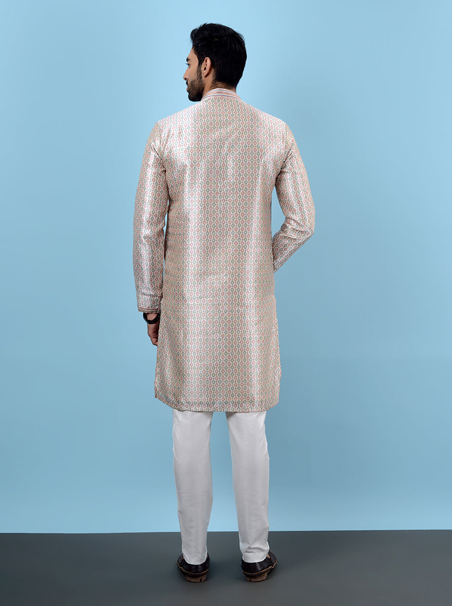 Elegant beige and pink men’s kurta set, perfect for USA haldi and weddings.