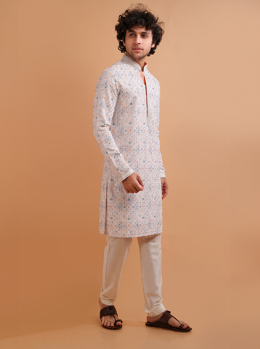 Discover comfort and elegance with this white kurta pajama set, ideal for festive gatherings in the USA.