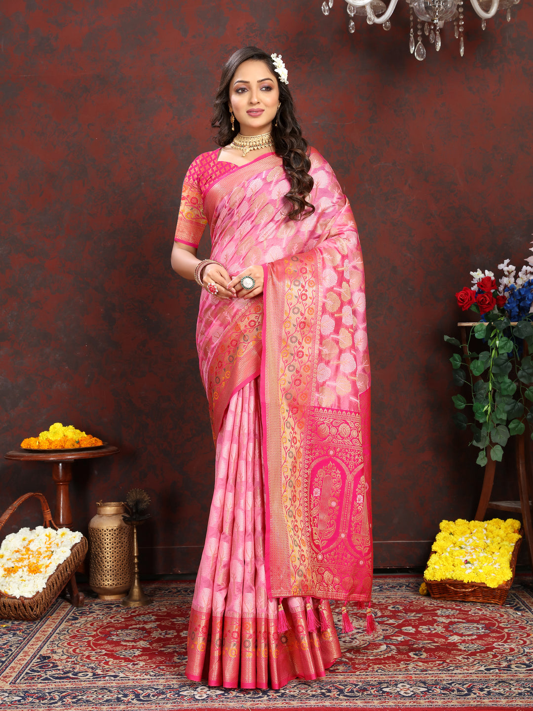 Luxurious orange Organza silk saree with exquisite Meenakari artistry, ideal for special gatherings.