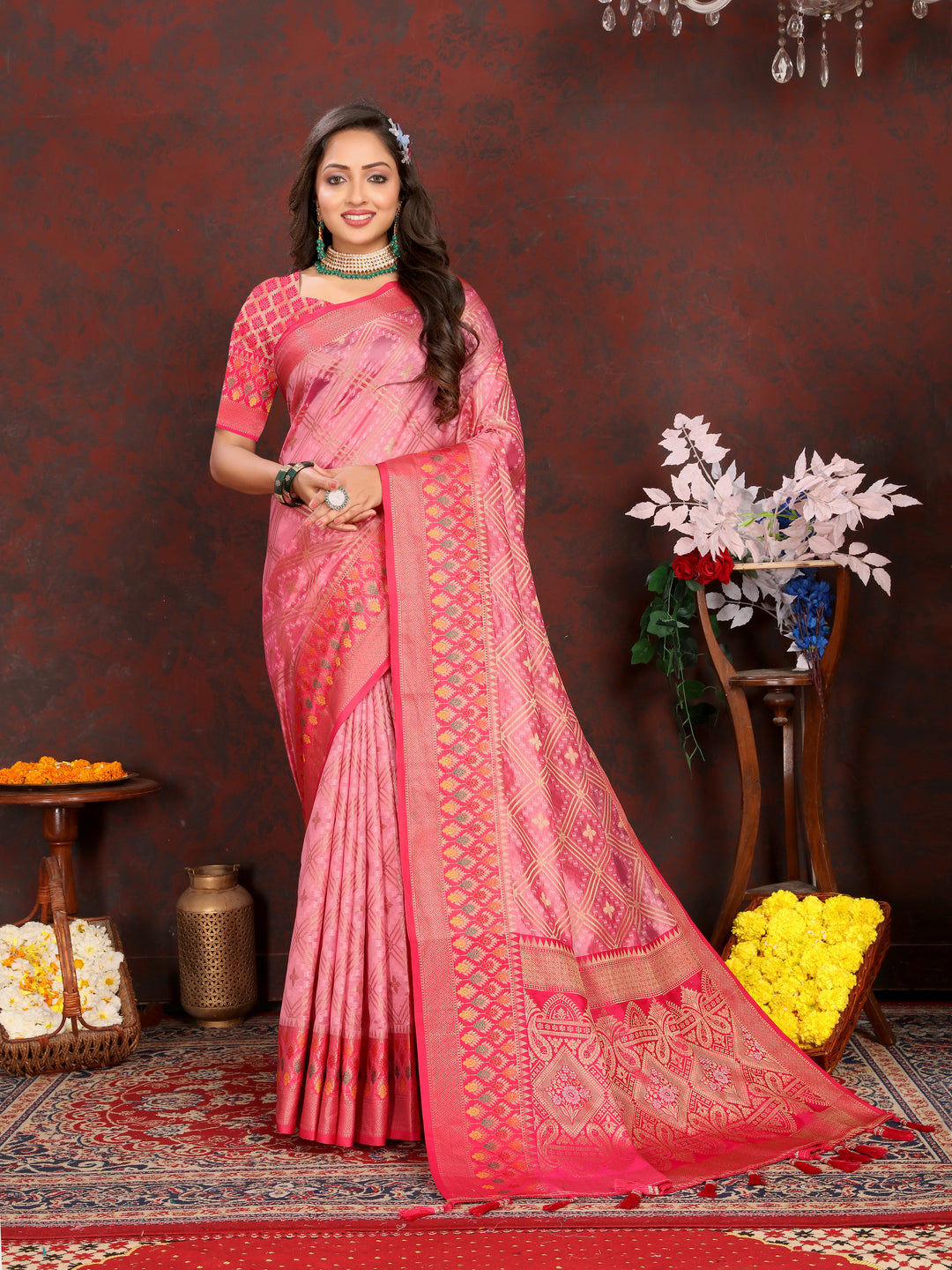 Elegant pink Organza silk saree with luxurious zari weaving and detailed Meenakari pallu, ideal for celebrations.