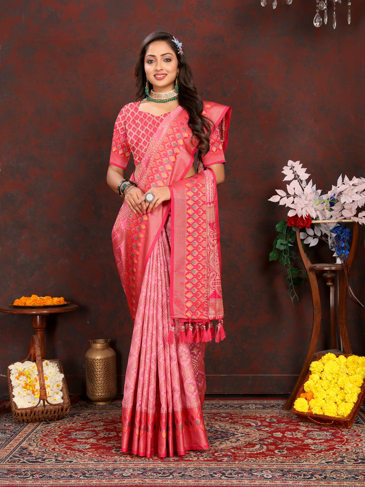 Designer pink Meenakari Organza silk saree with intricate zari weaving, ideal for grand events.