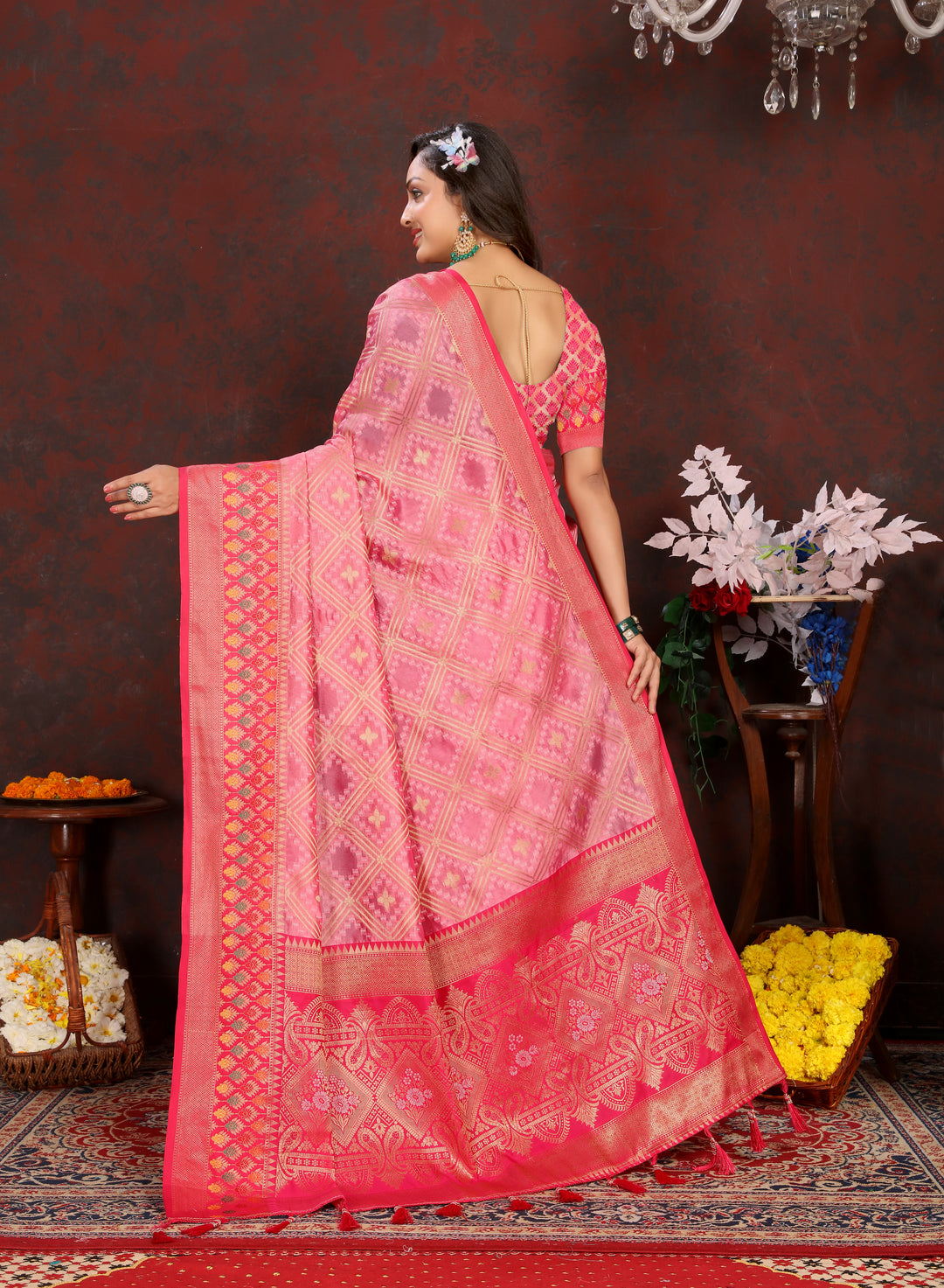 Classic pink Organza silk saree with luxurious zari and Meenakari design, ideal for cultural gatherings.