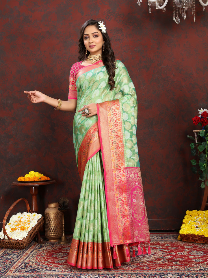 Pink Organza silk saree with elegant Meenakari artistry, perfect for special Indian ceremonies.