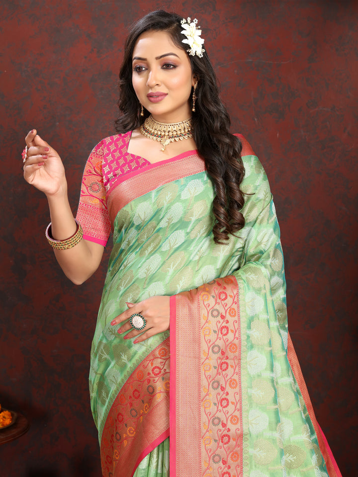 Pista green Meenakari Organza silk saree with intricate weaving, ideal for cultural events.