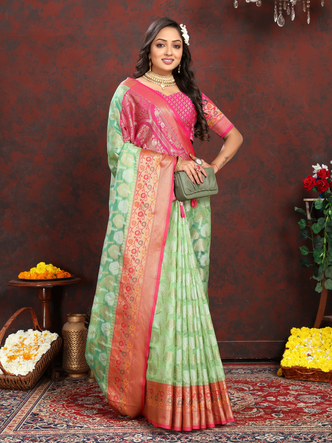 Elegant pista green Organza silk saree with exquisite Meenakari design, perfect for traditional gatherings.