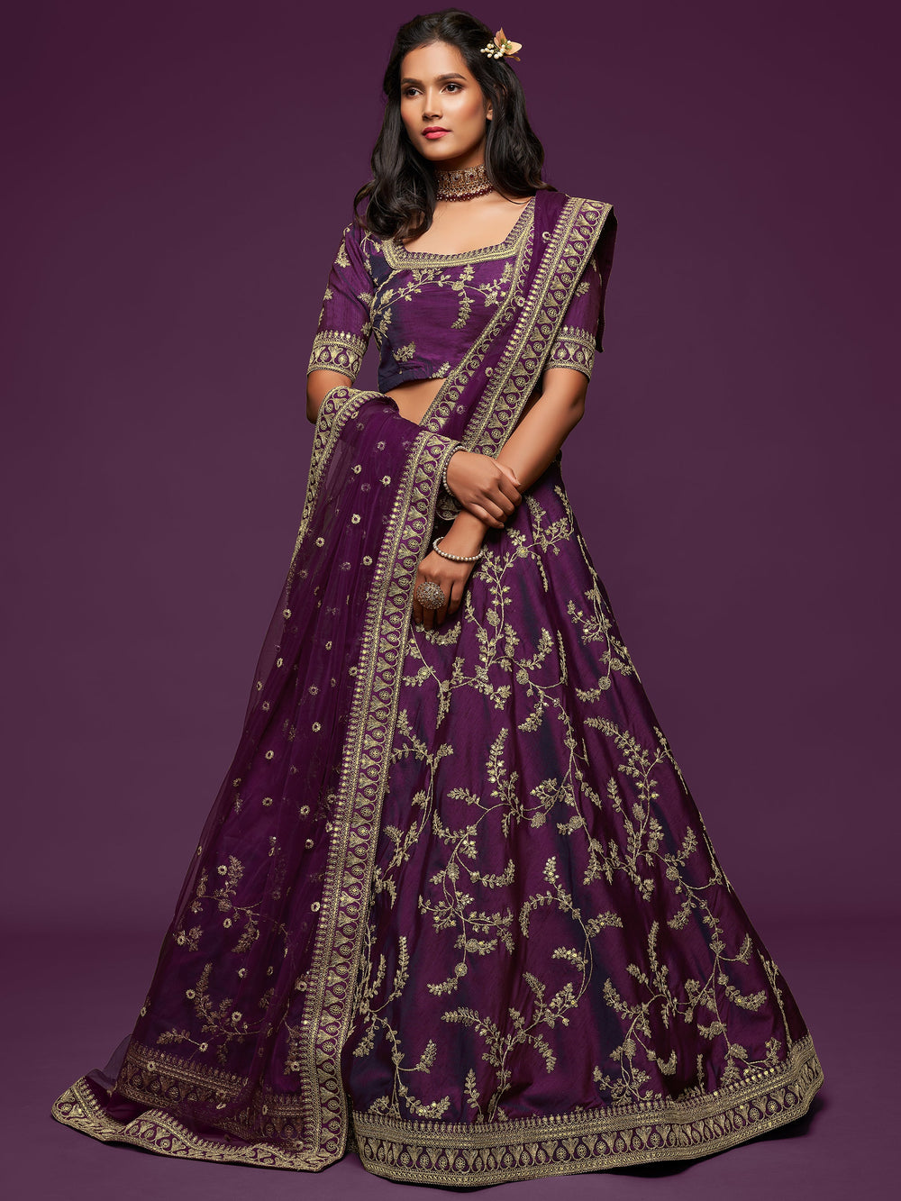 Bridal lehenga with matching choli and net dupatta for events and occasions.