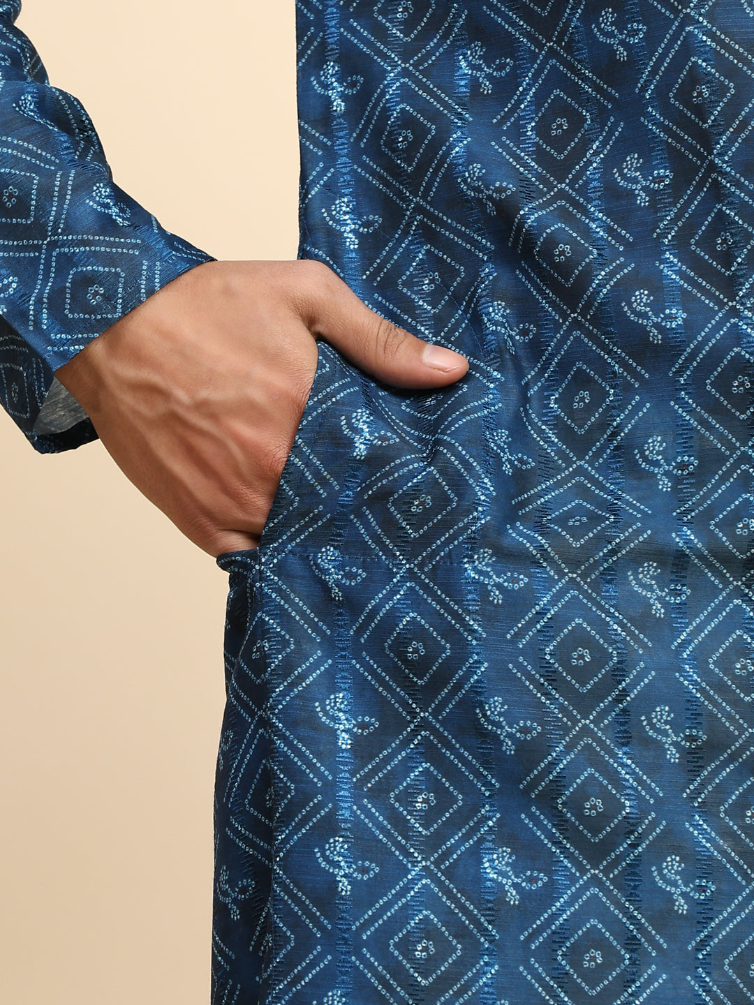 Men's blue kurta pajama set with modern geometric print for festive occasions.