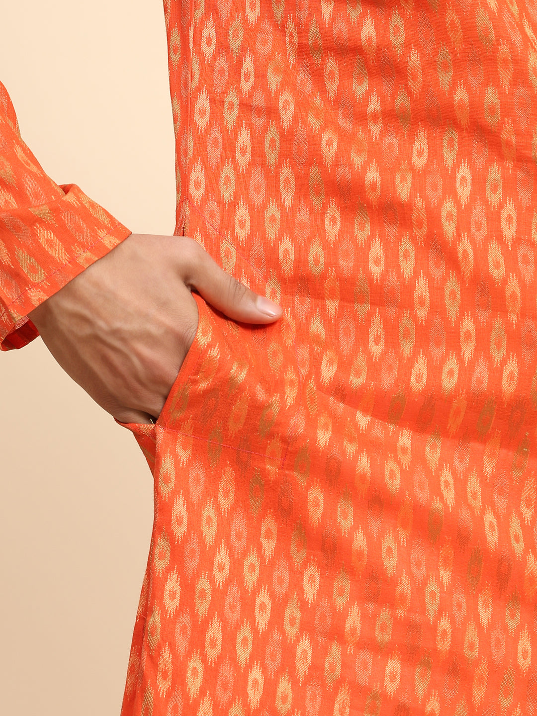 Orange kurta pajama for men featuring premium cotton fabric and elegant handwoven designs.