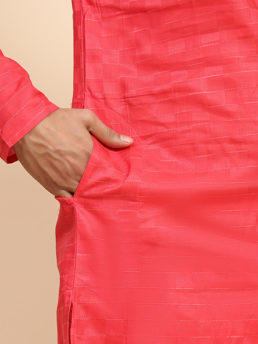 Men’s red kurta pajama with intricate embroidery, ideal for festive occasions.