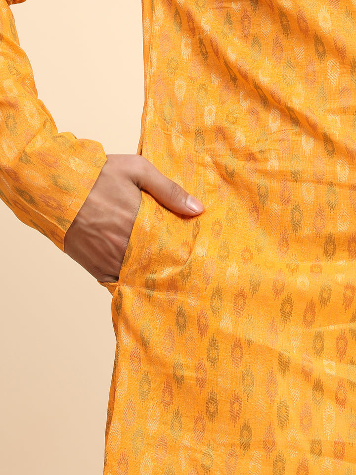 Pure cotton light orange kurta pajama for men with stylish ethnic design.