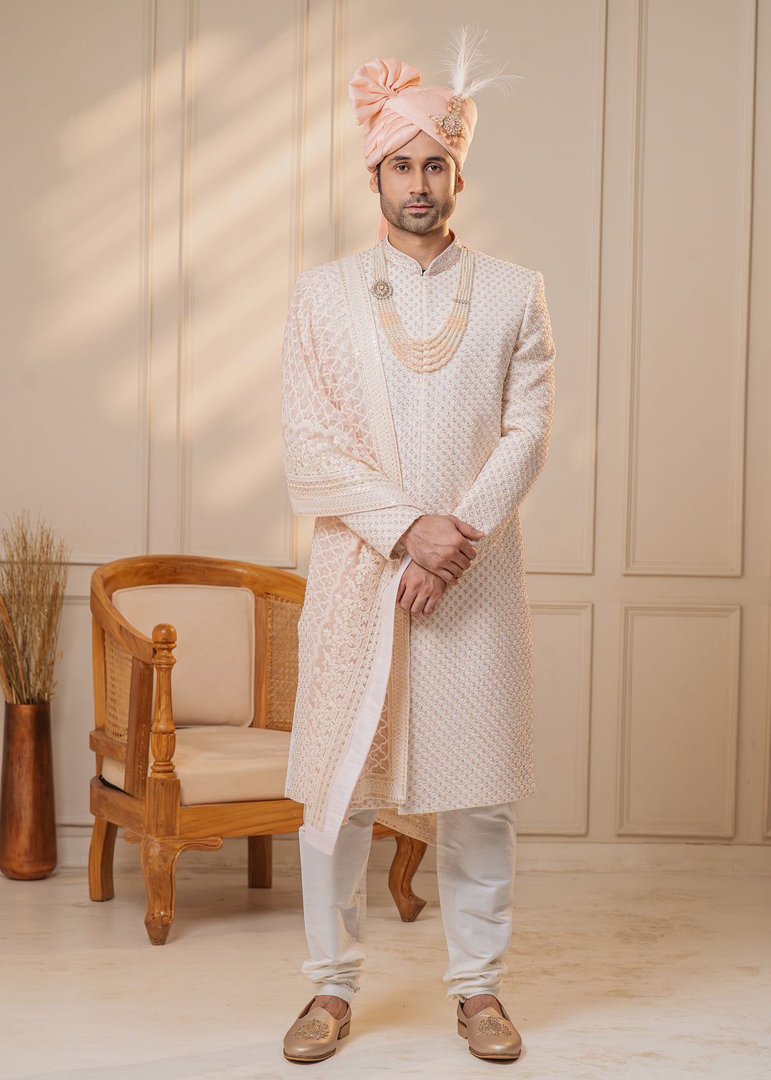 Elevate your wedding attire with this off-white sherwani, showcasing intricate zardosi and cut-dana work.