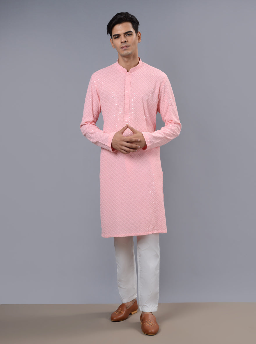 Unique pink kurta pajama designed to exude elegance and sophistication during festive gatherings.