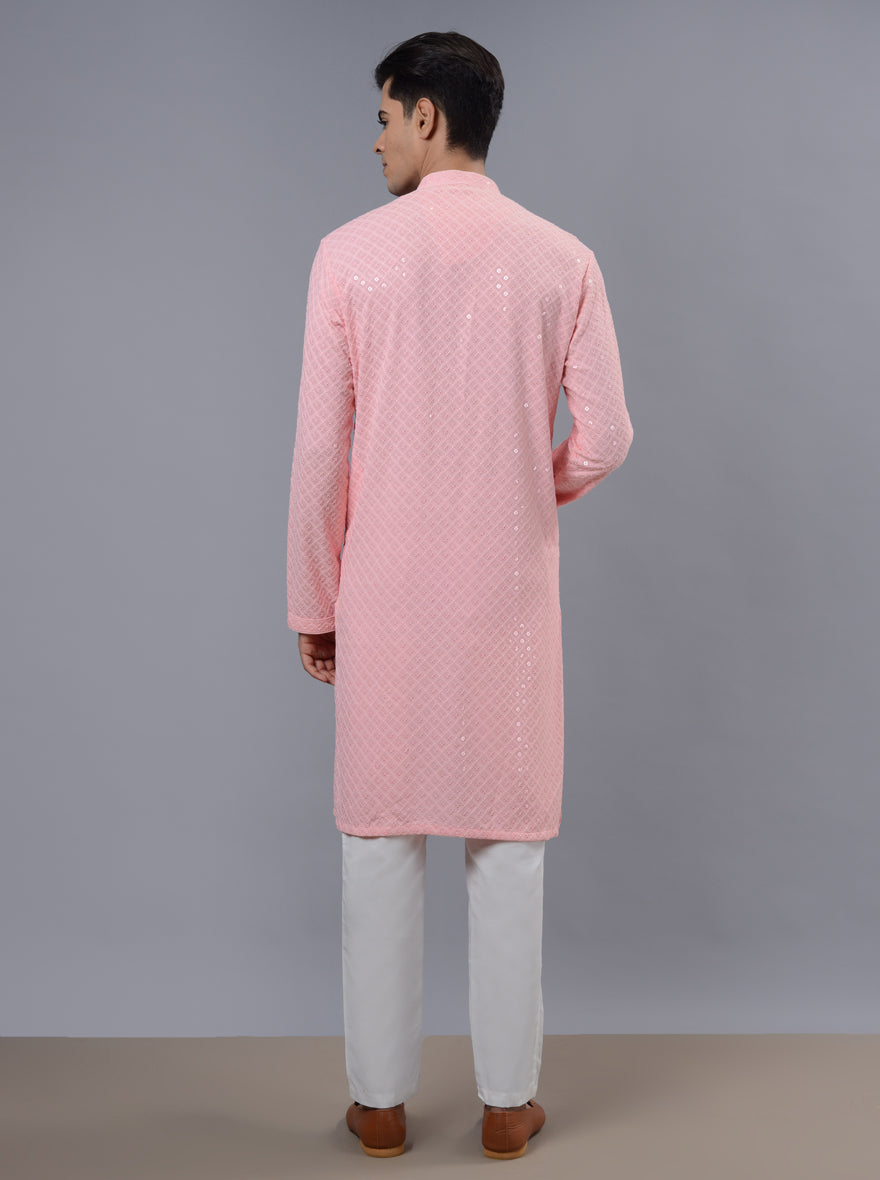 Celebrate in style with our pink kurta pajama, ideal for men's attire during special occasions.