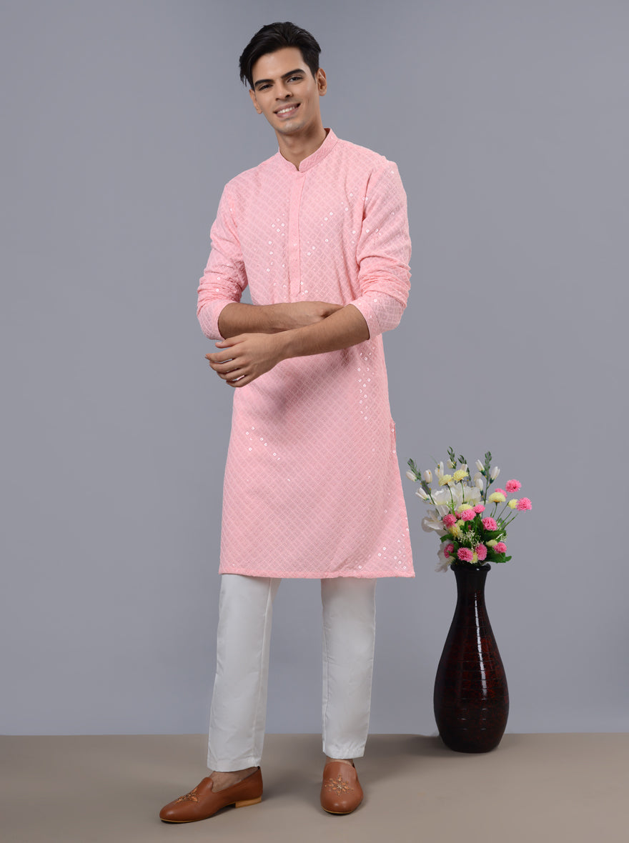 Stylish pink kurta pajama for men, perfect for kankotri and pooja celebrations.