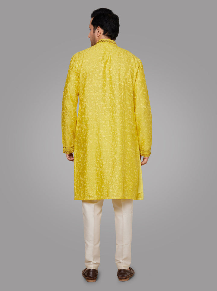 Stylish yellow kurta pajama set with exquisite embroidery, perfect for adding a vibrant touch to your celebrations in the USA.