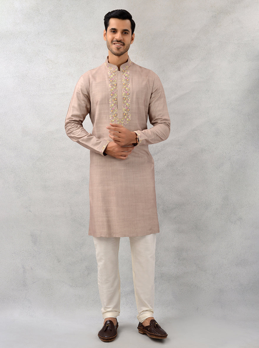 Celebrate in elegance with this dune brown kurta pajama, featuring intricate embroidery for special events in the USA.