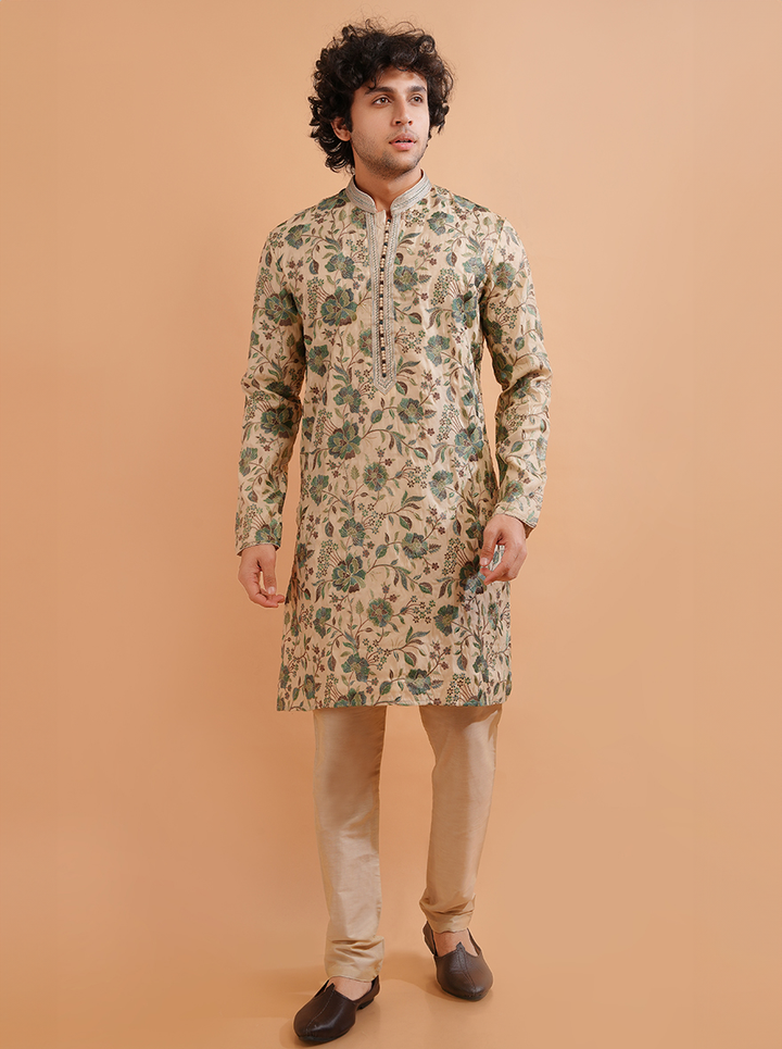 Celebrate in style with this Cream & Green Silk Blend Kurta Pajama set, showcasing exquisite embroidery for men.