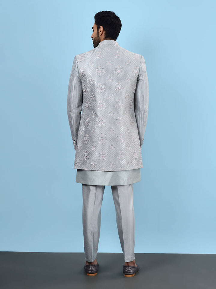 Dress to impress at your mehndi celebration in the USA with this eye-catching Grey Indowestern, designed with soft silk blend fabric and delicate embroidery for a festive flair.