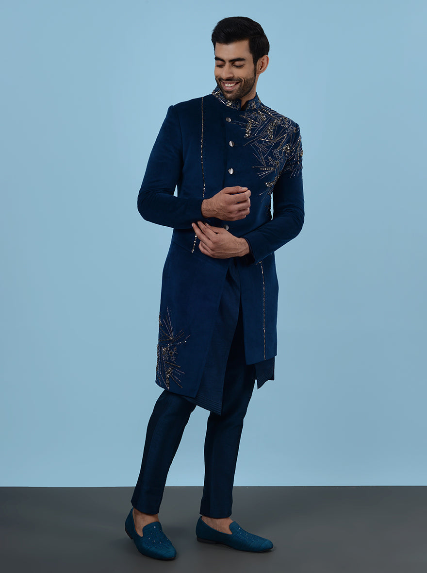 Shine at your special event in the USA with this fashionable Blue Indowestern, crafted from high-quality suede and adorned with elegant embroidery, perfect for sangeet festivities.