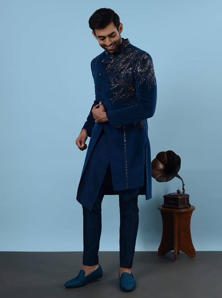 Celebrate in style at your sangeet in the USA with this stunning Blue Indowestern, featuring soft suede fabric and beautiful embroidery for a perfect fit at any event.