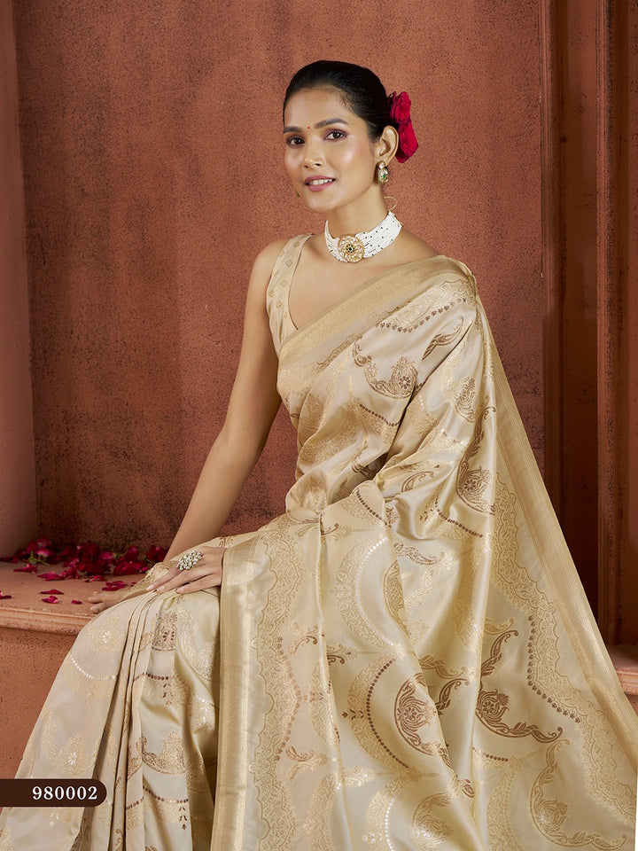 Traditional cream Banarasi saree with delicate zari work, ideal for wedding celebrations.