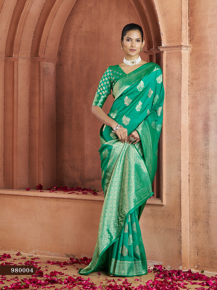 Rich green Banarasi saree with woven motifs and silk blouse, perfect for weddings.