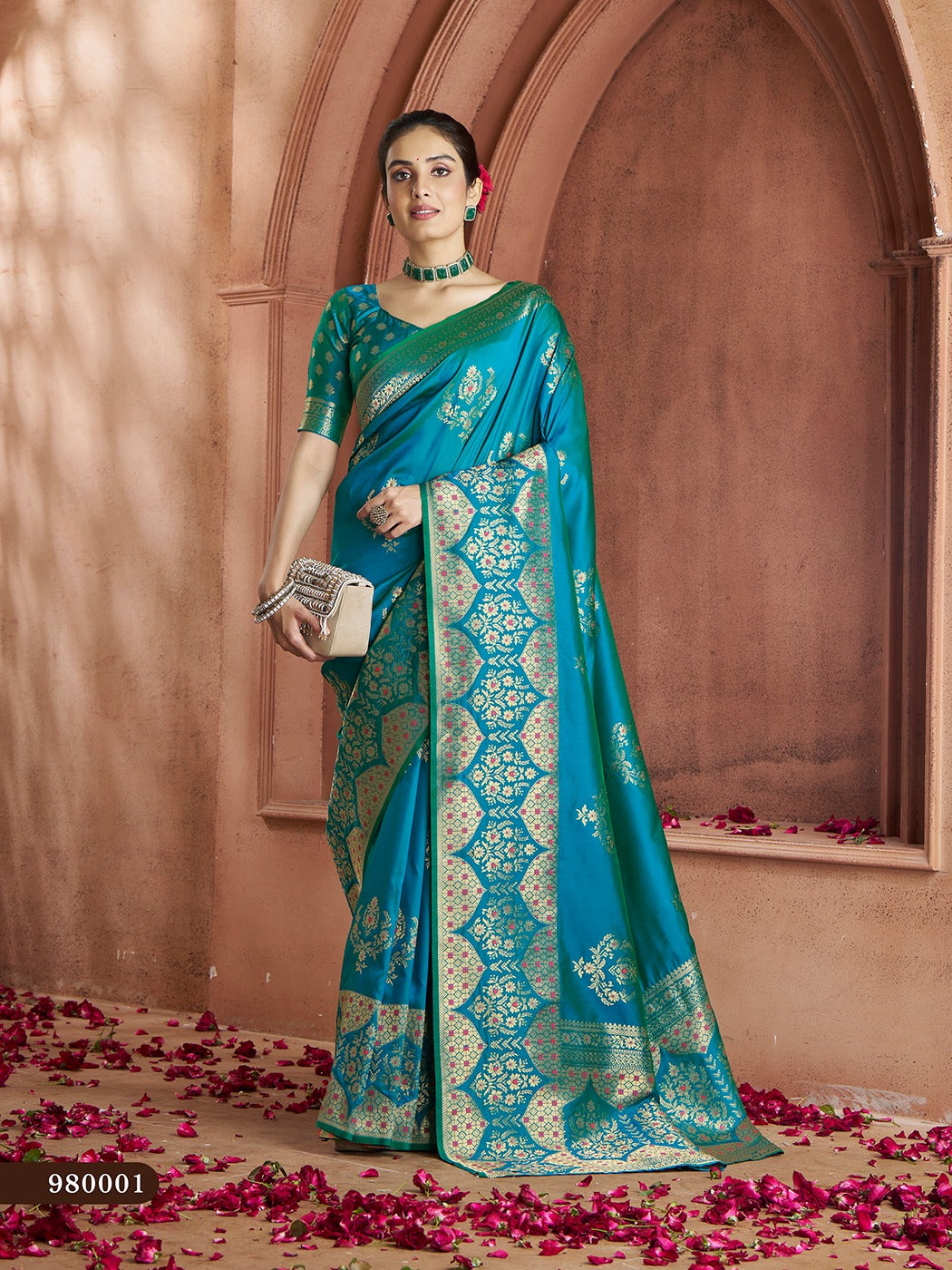 Elegant teal-blue Banarasi saree with intricate gold zari work, perfect for weddings.