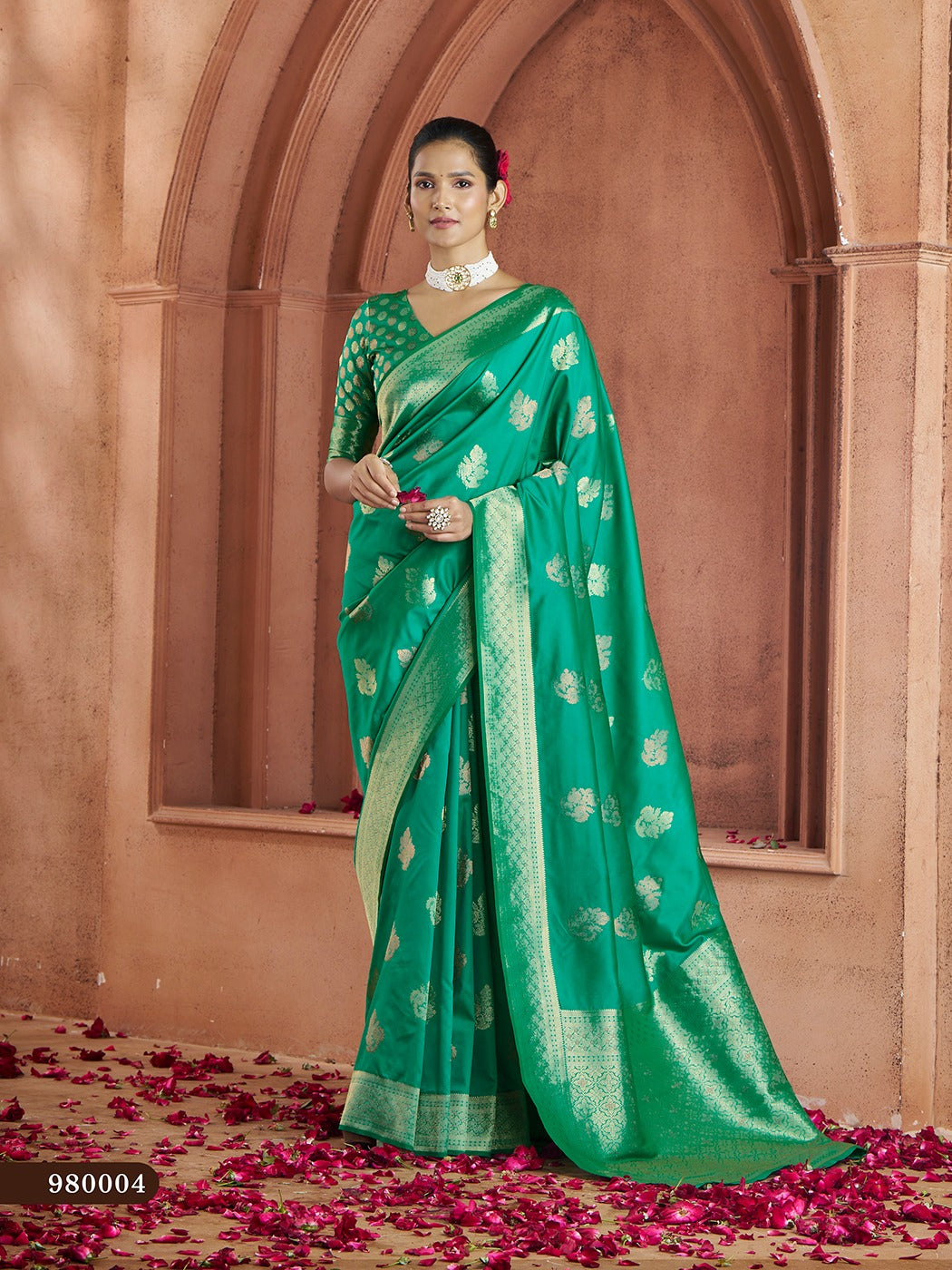 Traditional green Banarasi saree with stunning zari work and silk blouse included.