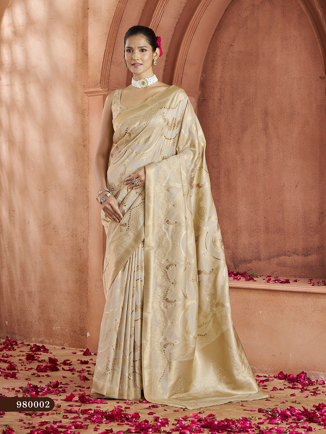 Timeless cream Banarasi saree with stunning gold zari design, complete with silk blouse.