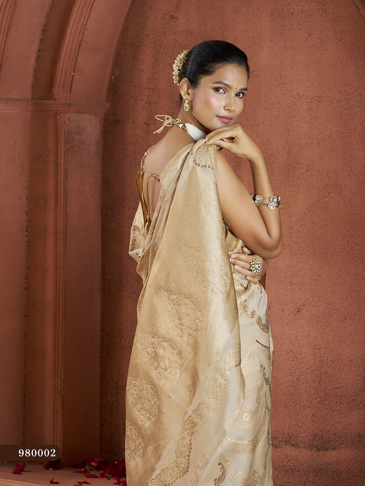 Elegant cream Banarasi saree with classic gold accents and silk blouse for weddings.